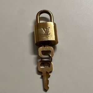 Authentic Louis Vuitton lock and key set.
